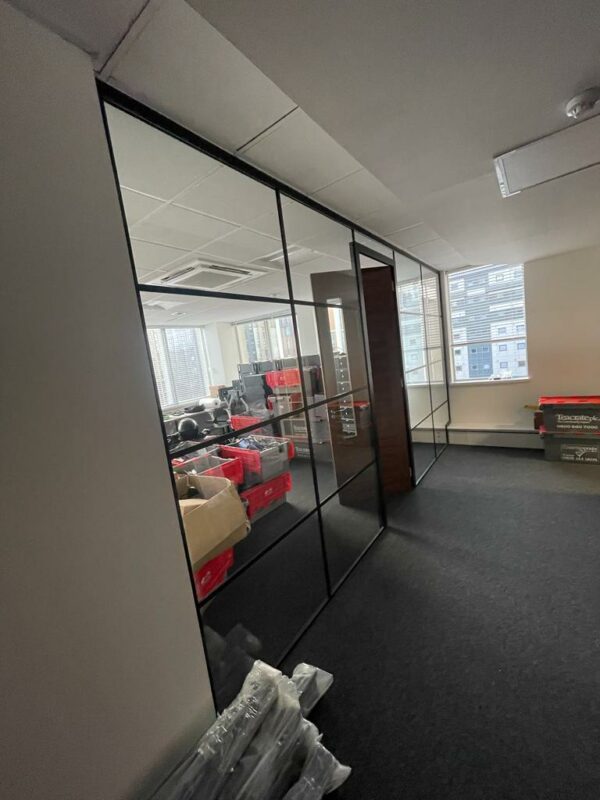 Timber door open with singled glazed glass office partitioning system to separate offices