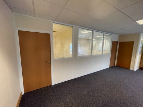 Office space with part heigh double glazed partition and wooden doors